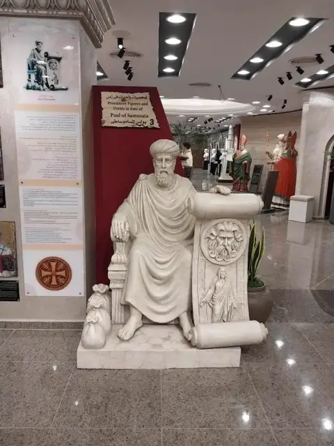 Seated Father with Scroll